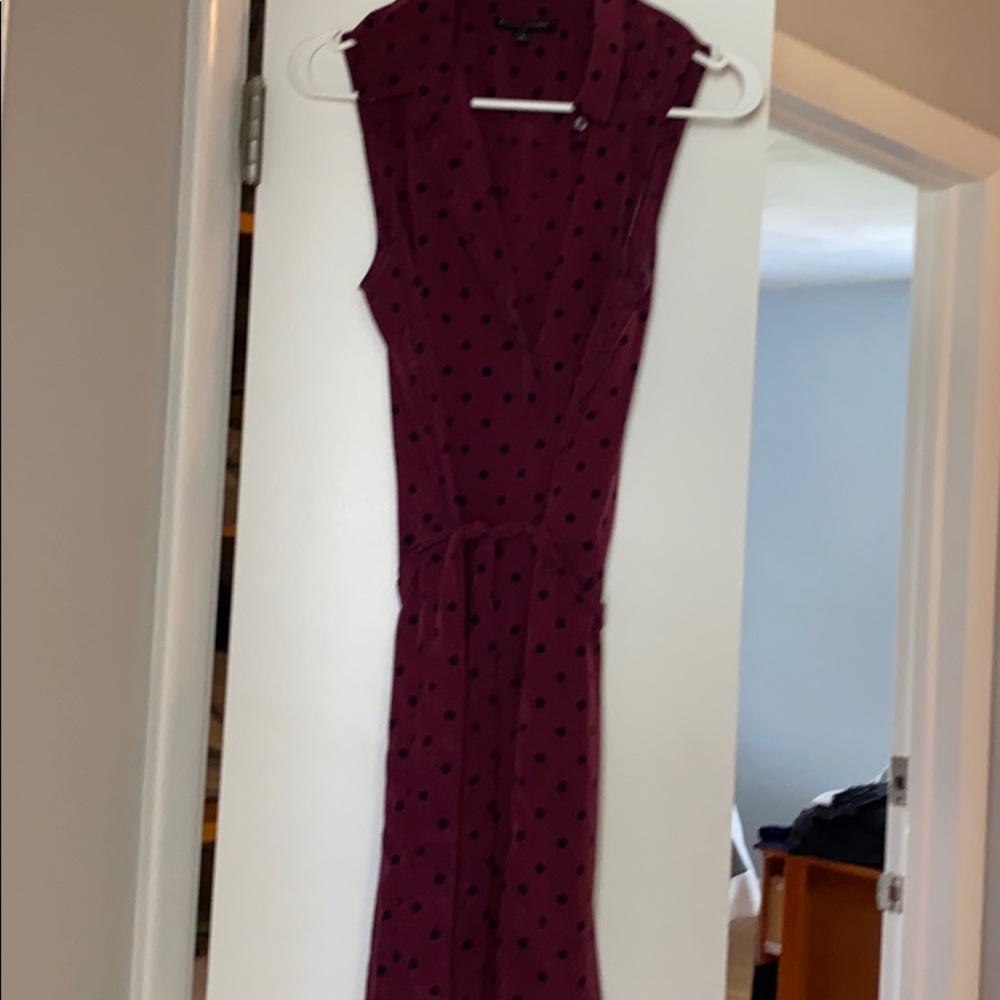 A sleeveless dress with a tie waist